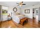 Bright bedroom with hardwood floors, large windows and ceiling fan at 34868 Prospect Rd, Dade City, FL 33525
