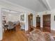 Entryway with hardwood floors, grandfather clock, and view of dining room at 34868 Prospect Rd, Dade City, FL 33525