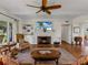 Living room boasts hardwood floors, a fireplace, and ample natural light at 34868 Prospect Rd, Dade City, FL 33525