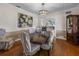 Formal dining room with hardwood floors and large artwork at 34868 Prospect Rd, Dade City, FL 33525