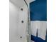 Walk-in shower with white tile and patterned shower curtain at 34868 Prospect Rd, Dade City, FL 33525
