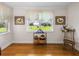 Bright sitting room with wood floors and views of the pasture at 34868 Prospect Rd, Dade City, FL 33525