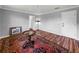 Bedroom with hardwood floors, area rug, and access to closet at 34868 Prospect Rd, Dade City, FL 33525