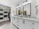 Bathroom features double vanity, marble countertop and walk-in closet at 34868 Prospect Rd, Dade City, FL 33525