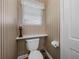 Small bathroom with toilet and window at 34868 Prospect Rd, Dade City, FL 33525