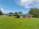 Long ranch home with a large green lawn at 34868 Prospect Rd, Dade City, FL 33525