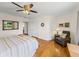 Charming bedroom with hardwood floors, a ceiling fan, and built-in closet at 34868 Prospect Rd, Dade City, FL 33525