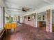 Brick floor sunroom with views to living areas and backyard at 34868 Prospect Rd, Dade City, FL 33525