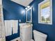 Clean bathroom with white vanity and blue walls at 34868 Prospect Rd, Dade City, FL 33525