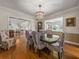 Dining room with hardwood floors and view into living room at 34868 Prospect Rd, Dade City, FL 33525