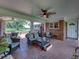 Brick patio with wicker furniture and a view of the property at 34868 Prospect Rd, Dade City, FL 33525