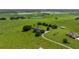 Aerial view of a large property with two houses and several ponds at 34868 Prospect Rd, Dade City, FL 33525