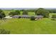 Aerial view of a ranch-style home on a large lot with lush green pastures at 34868 Prospect Rd, Dade City, FL 33525