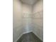 Large walk-in closet with wire shelving and carpet flooring at 13260 Ogden Glade Rd, Dade City, FL 33525