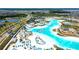 Aerial view of a large crystal lagoon and beach area at 9293 Rally Spring Loop, Wesley Chapel, FL 33545