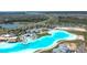 Aerial view of Crystal Lagoon amenity, highlighting its size and features at 9293 Rally Spring Loop, Wesley Chapel, FL 33545