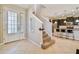 Bright entryway with tile flooring and staircase to second floor at 17012 Vilesta Dr, Lutz, FL 33548