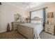 Well-lit bedroom with a full-size bed and dresser at 9336 Melody Cir, Port Charlotte, FL 33981