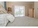 Bedroom with pool view and access to the bathroom at 9336 Melody Cir, Port Charlotte, FL 33981