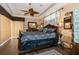 Large main bedroom with a dark wood sleigh bed and decorative pillows at 9336 Melody Cir, Port Charlotte, FL 33981