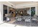 Outdoor patio with table and chairs, offering views into the home's interior at 9336 Melody Cir, Port Charlotte, FL 33981