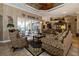 Comfortable living room with ornate sofas, coffee table, and access to the pool at 9336 Melody Cir, Port Charlotte, FL 33981