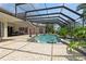 Resort-style pool with screened enclosure and brick paver deck at 9336 Melody Cir, Port Charlotte, FL 33981