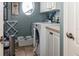 Convenient laundry room with washer, dryer, and storage at 9336 Melody Cir, Port Charlotte, FL 33981