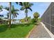 Screened-in pool and patio area with lush landscaping at 9336 Melody Cir, Port Charlotte, FL 33981