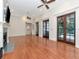 Large living room with hardwood floors, fireplace, and French doors at 15704 Cheston Ct, Tampa, FL 33647