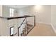 Upstairs hall with hardwood floors and chandelier at 15704 Cheston Ct, Tampa, FL 33647