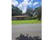 Ranch style home with a spacious lawn and mature trees at 5023 6Th St, Zephyrhills, FL 33542