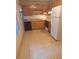 Kitchen with wood cabinets, a dishwasher, and tile floor at 5023 6Th St, Zephyrhills, FL 33542