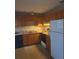 Kitchen with wood cabinets, double sink and appliances at 5023 6Th St, Zephyrhills, FL 33542