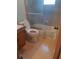 Bathroom with shower/tub combo and tile flooring at 5023 6Th St, Zephyrhills, FL 33542