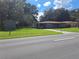 Image shows a ranch home with carport and storage shed at 5023 6Th St, Zephyrhills, FL 33542