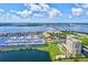 Aerial view of waterfront community with marina and high-rise building at 130 Riviera Dunes Way # 403, Palmetto, FL 34221