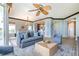 Comfortable living room with large windows and water views at 130 Riviera Dunes Way # 403, Palmetto, FL 34221