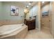 Bathroom with soaking tub and separate shower at 130 Riviera Dunes Way # 403, Palmetto, FL 34221