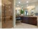Elegant bathroom with double vanity, soaking tub, and shower at 130 Riviera Dunes Way # 403, Palmetto, FL 34221