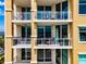 Private balcony with glass railings and water views at 130 Riviera Dunes Way # 403, Palmetto, FL 34221