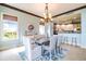 Bright dining room with chandelier and water views at 130 Riviera Dunes Way # 403, Palmetto, FL 34221