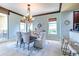 Elegant dining room featuring a chandelier and water views at 130 Riviera Dunes Way # 403, Palmetto, FL 34221