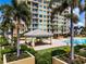Relaxing pool area with gazebo, grill, and lush landscaping at 130 Riviera Dunes Way # 403, Palmetto, FL 34221