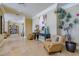 Elegant condo lobby with seating area and bookcases at 130 Riviera Dunes Way # 403, Palmetto, FL 34221