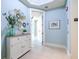Bright entryway with built-in storage and access to other rooms at 130 Riviera Dunes Way # 403, Palmetto, FL 34221