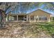 Charming home with screened lanai, and well-maintained lawn at 1145 Almondwood Dr, Trinity, FL 34655