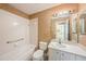 Clean bathroom with a tub, toilet and vanity at 1145 Almondwood Dr, Trinity, FL 34655