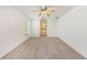Bright bedroom featuring plush carpet, ceiling fan, and an ensuite bathroom at 1145 Almondwood Dr, Trinity, FL 34655