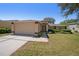 Charming single-story home with a well-maintained lawn and attached two-car garage at 1145 Almondwood Dr, Trinity, FL 34655
